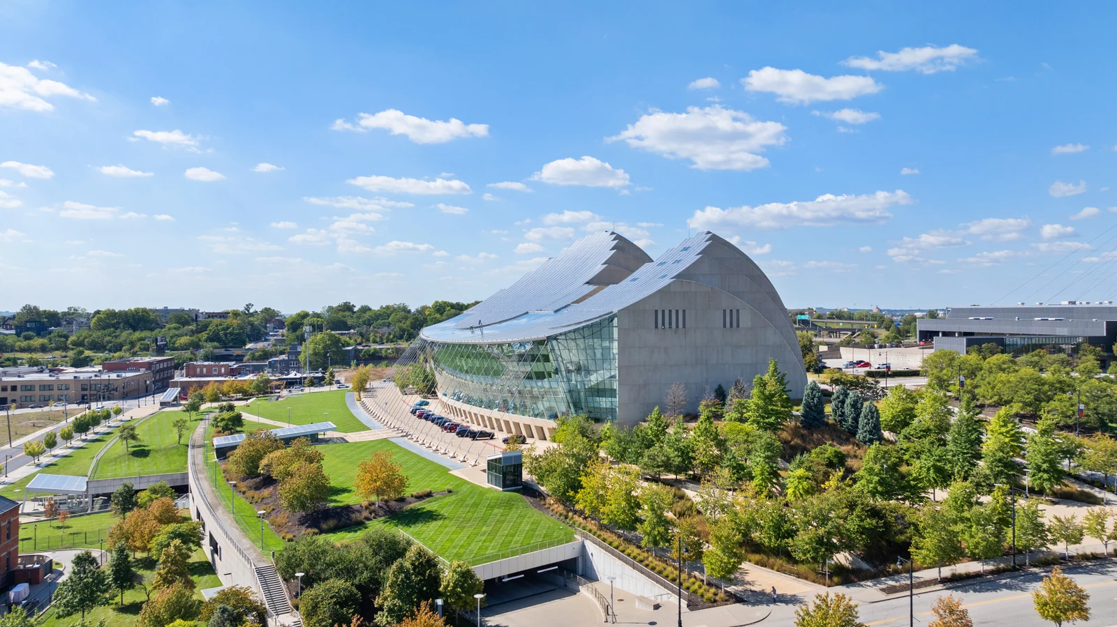 Commercial architecture with a glass facade and landscaped grounds